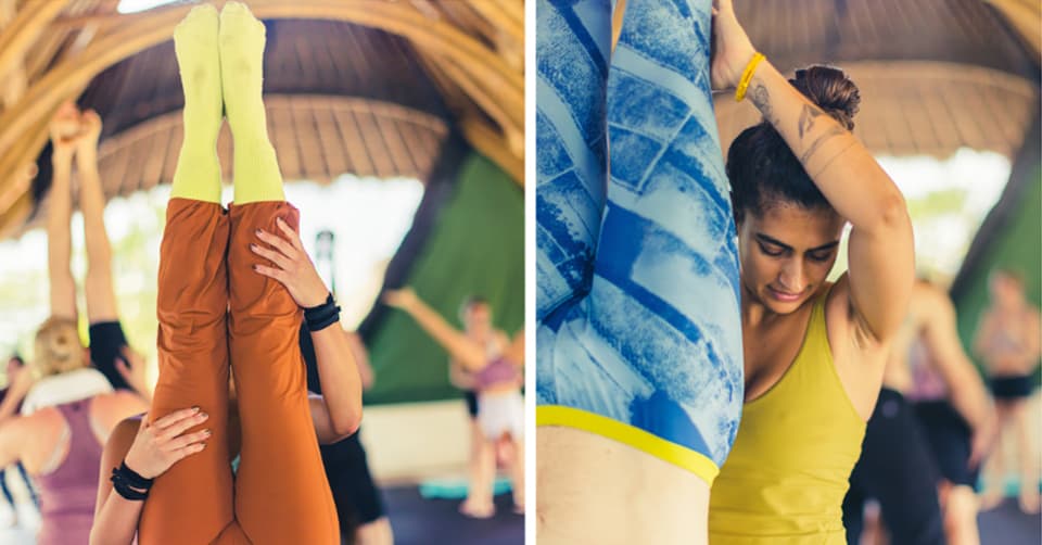 Άνδρας κάνει κατακόρυφο σε εξωτερικό χώρο με φόντο τη φύση.